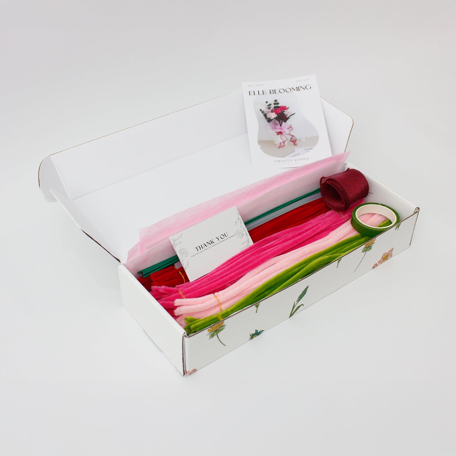 Sweety Roses DIY bouquet made from pink and red pipe cleaner roses with heart-shaped detail. Wrapped in sheer white and pink, finished with a red organza ribbon a handmade floral gift for love and celebration.