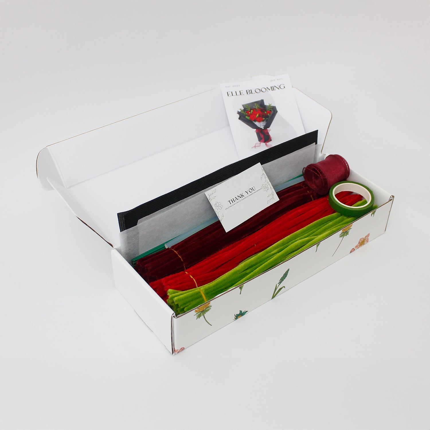 Rouge Noir DIY bouquet with deep red carnations, roses, and celosia handcrafted from pipe cleaners. Wrapped in elegant black paper and tied with a burgundy ribbon, this bold floral arrangement is perfect for romantic or dramatic handmade gifts.