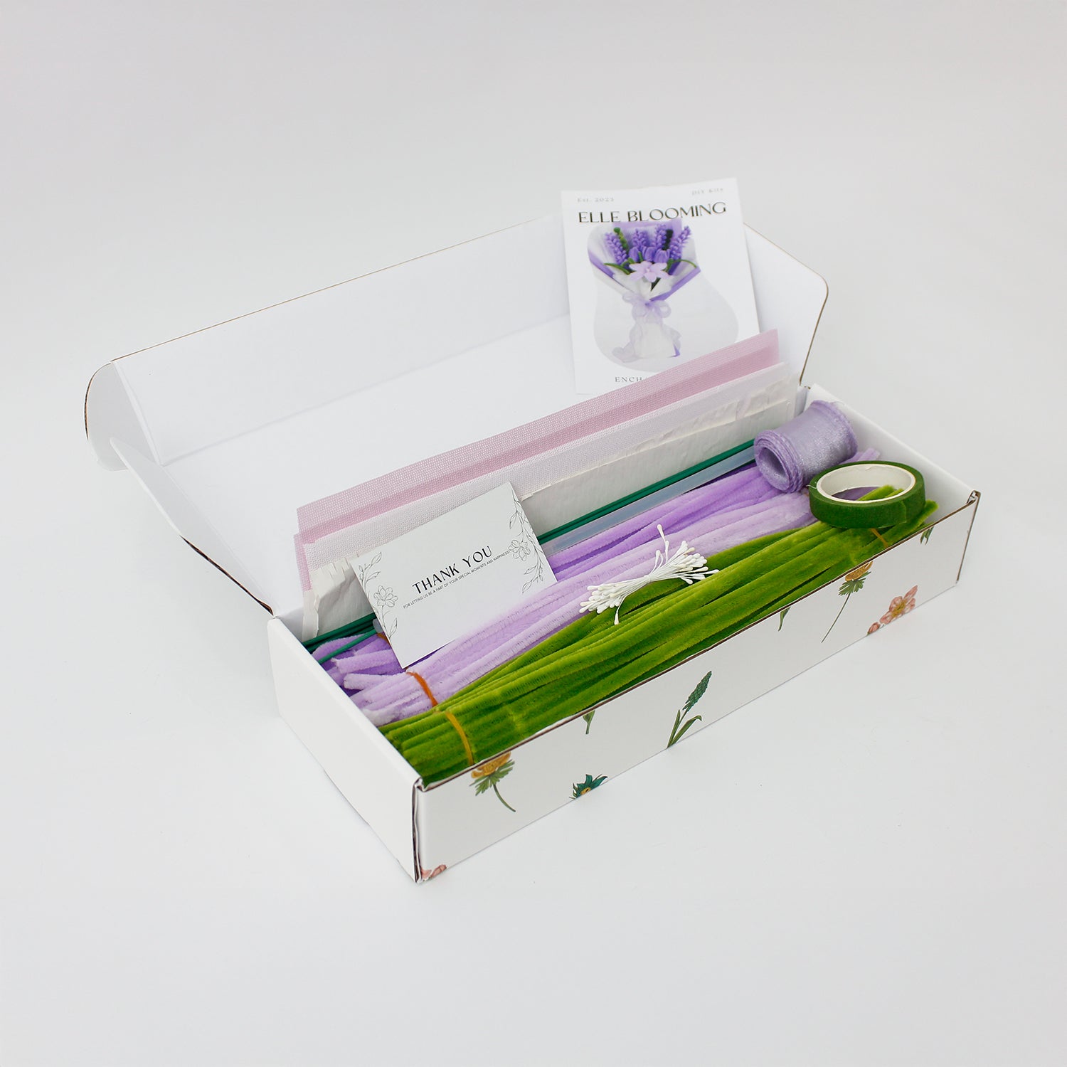 Enchanted Essence DIY flower bouquet featuring lavender stems, lilac tulips, and a central star lily made from soft pipe cleaners. Elegantly wrapped in lavender and white layers with a sheer ribbon bow a dreamy handmade gift idea.