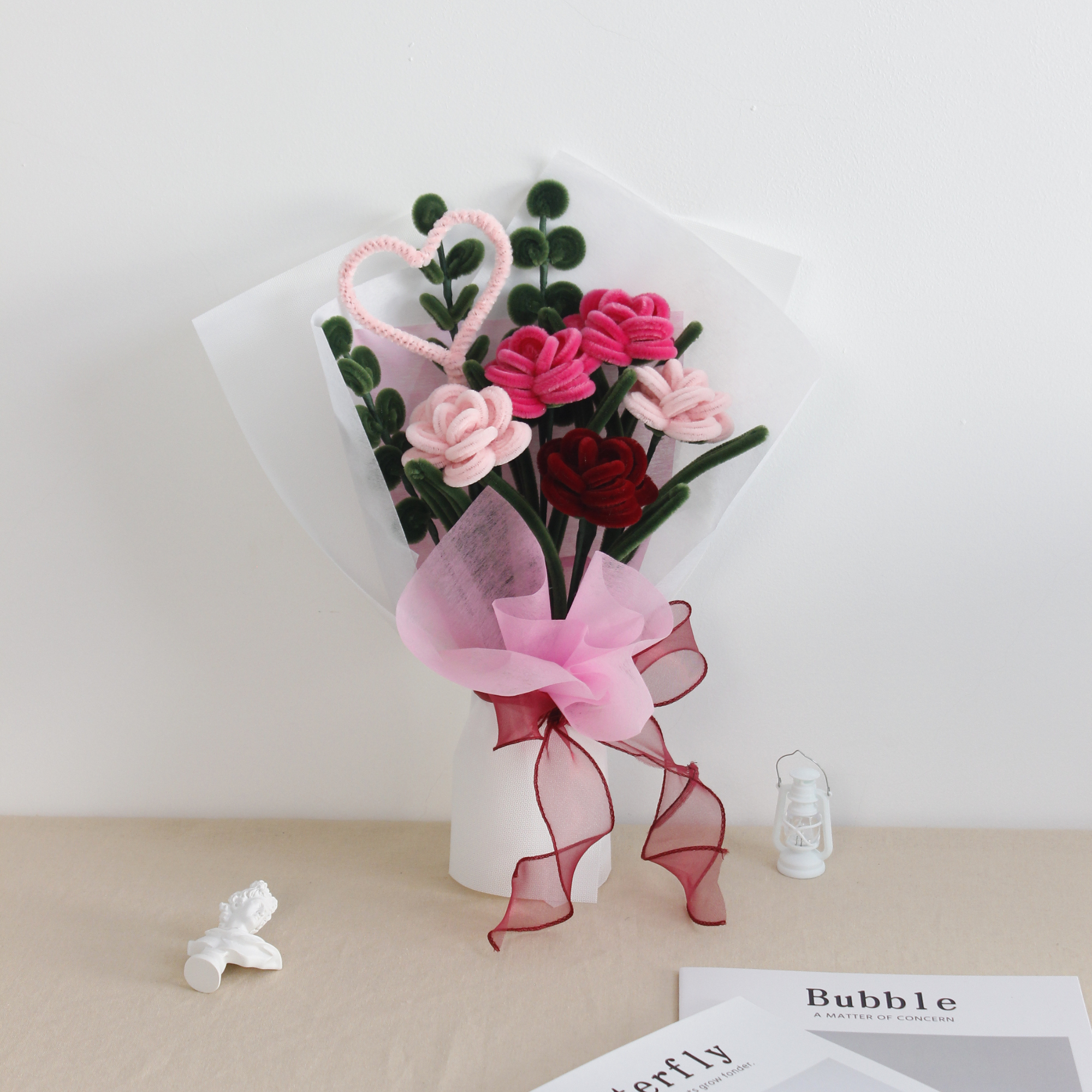 Sweety Roses DIY bouquet made from pink and red pipe cleaner roses with heart-shaped detail. Wrapped in sheer white and pink, finished with a red organza ribbon a handmade floral gift for love and celebration.