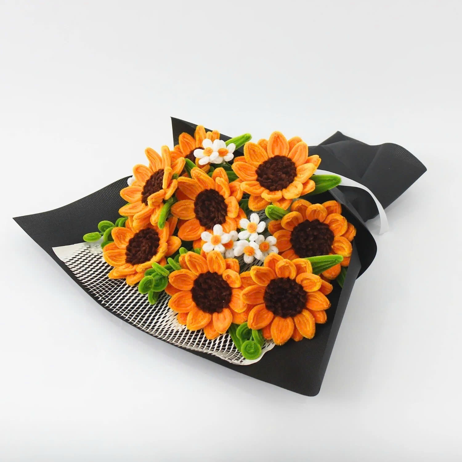 Golden Hour DIY sunflower bouquet made from vibrant orange pipe cleaners, featuring handmade daisies and lush green stems. Wrapped in black mesh and paper for a bold, elegant contrast ideal for DIY lovers and heartfelt handmade gifts.
