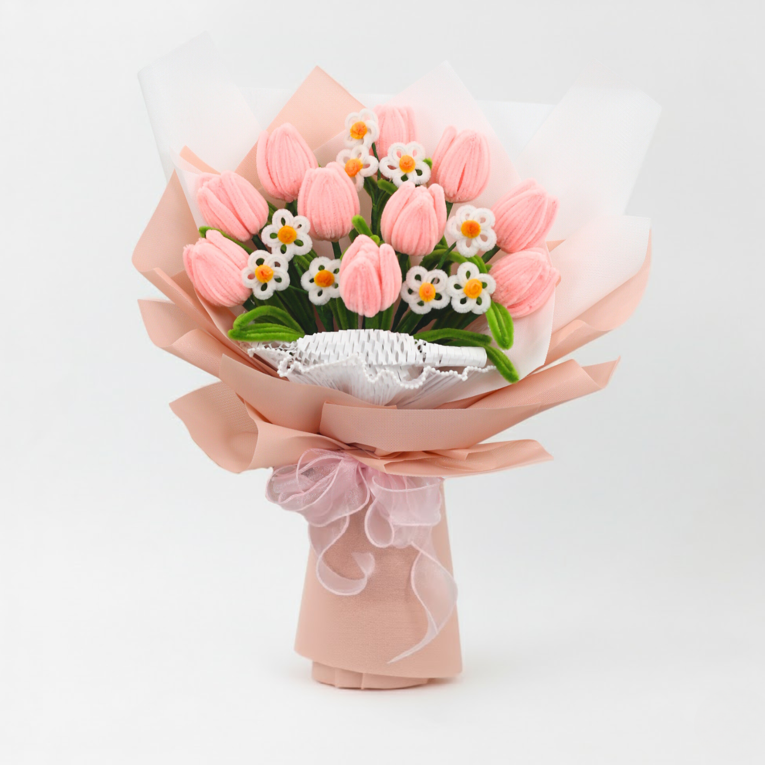 Sweet Blossoms DIY bouquet featuring soft pink tulips and white daisies made from fuzzy pipe cleaners. Wrapped in blush pink paper with a delicate sheer ribbon, this charming floral craft kit is ideal for handmade gifts and relaxing creativity.