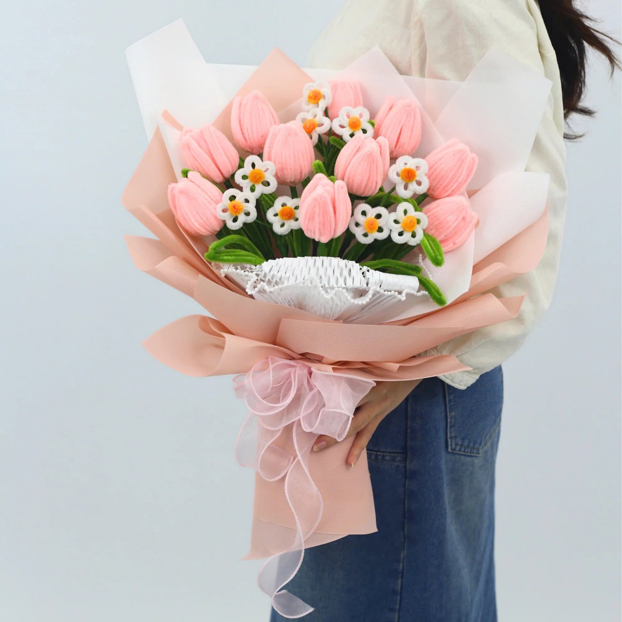 Sweet Blossoms DIY bouquet featuring soft pink tulips and white daisies made from fuzzy pipe cleaners. Wrapped in blush pink paper with a delicate sheer ribbon, this charming floral craft kit is ideal for handmade gifts and relaxing creativity.