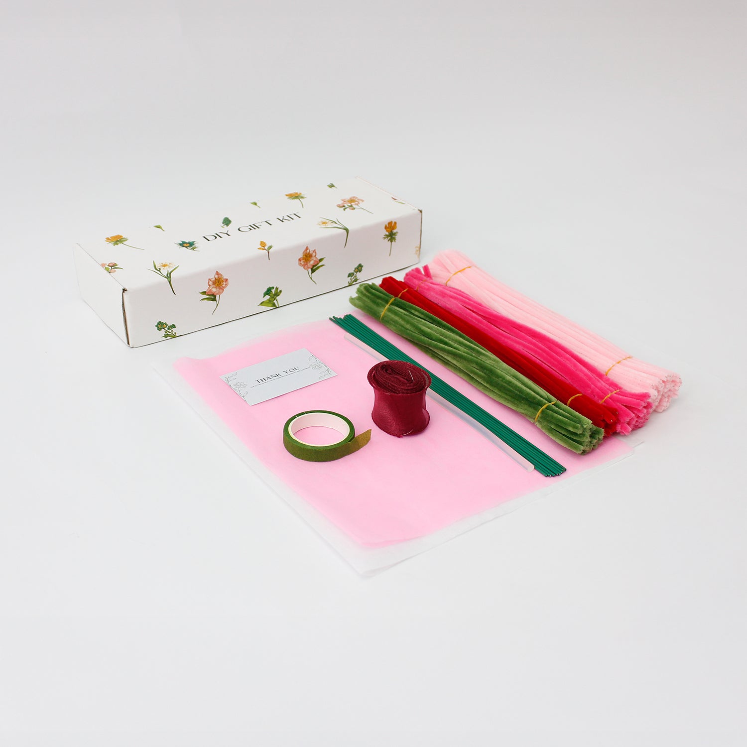 Sweety Roses DIY bouquet made from pink and red pipe cleaner roses with heart-shaped detail. Wrapped in sheer white and pink, finished with a red organza ribbon a handmade floral gift for love and celebration.