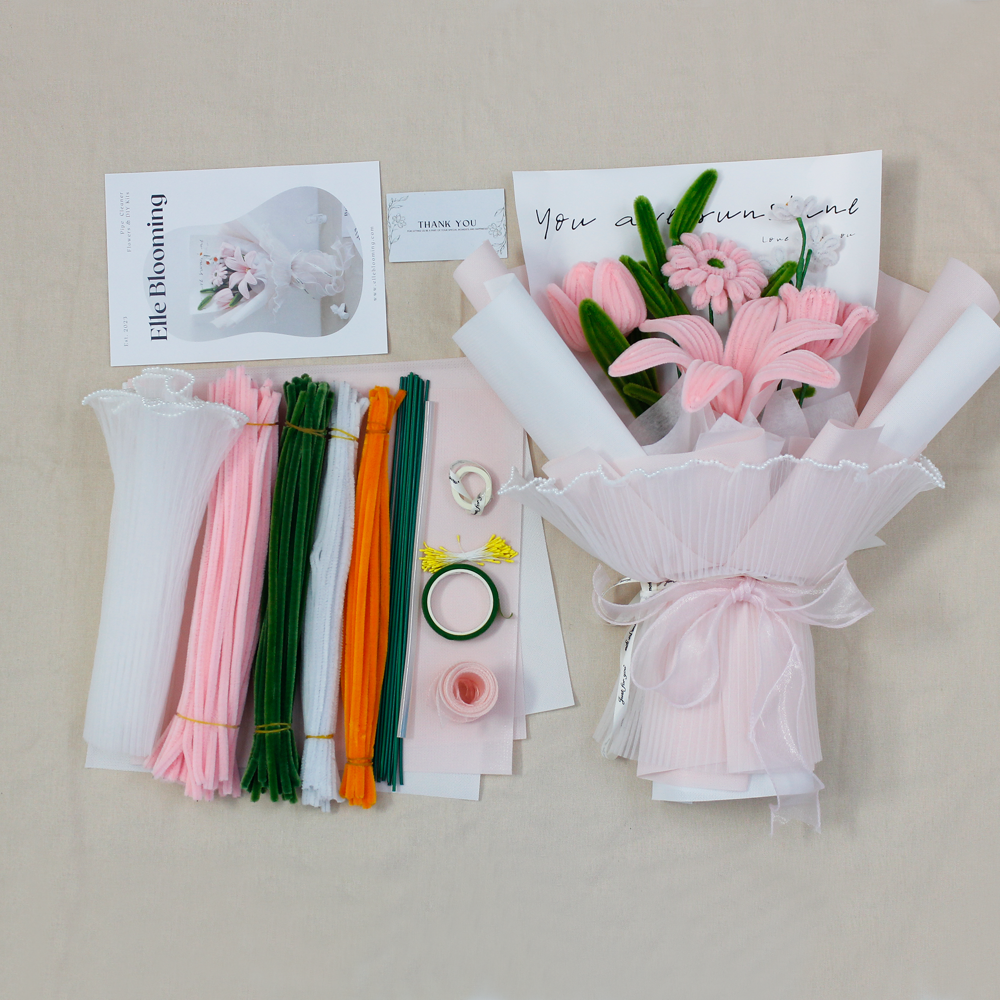 Elegant pink pipe cleaner DIY kit featuring lilies and daisies, includes full set of materials for crafting your own floral bouquet.
